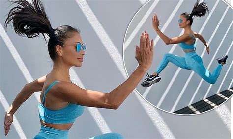 Nicole Scherzinger 42 Displays Her Honed Athletic Frame In Blue Gym Gear As She Jumps Into The