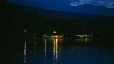 Premium Photo Lake Landscape With Mountains Background At Dark Blue
