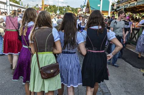 People Dressed In Traditional Bavarian Clothes At The Oktoberfest In