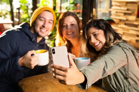 Free Photo Friends Taking A Selfie At Coffee Shop