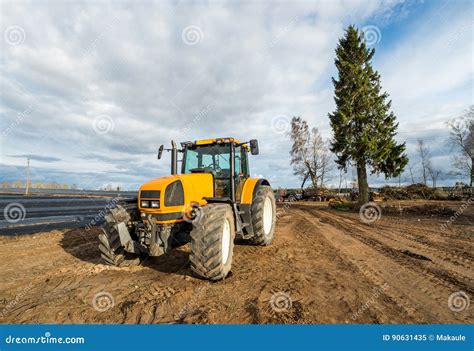 Yellow Tractor Works On Huge Landfill Of Big City A Lot Of Garbage On