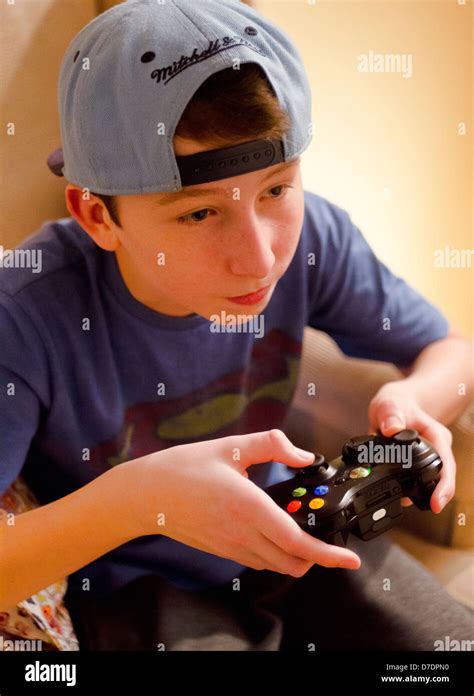 Teenage Boy Playing Xbox 360 Video Game Stock Photo Alamy