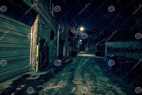 Dark Empty And Scary Urban City Street Alley At Night Stock Photo