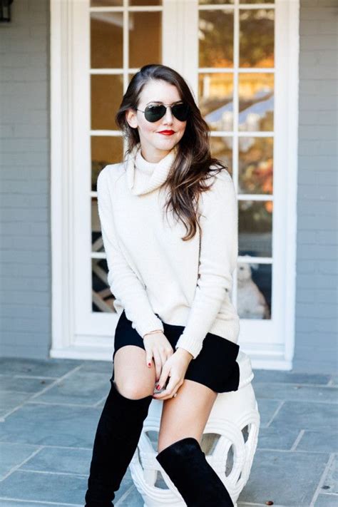 Amy Havins Wears A Cozy Sweater Paired With A Black Skirt And Over The