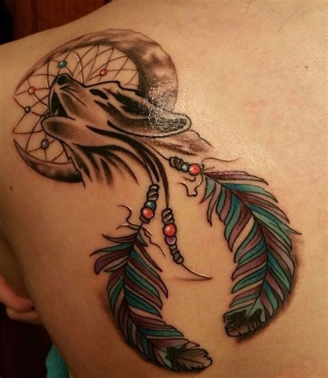 Wolf In A Dream Catcher Tattoo On The Shoulder Blade Done By