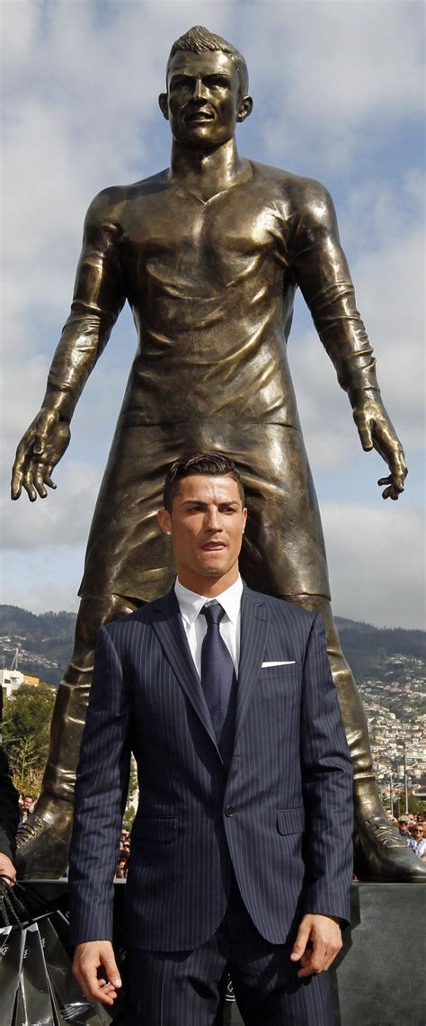 That ronaldo statue looks like bez. Cristiano Ronaldo is Honored with Bronze Statue