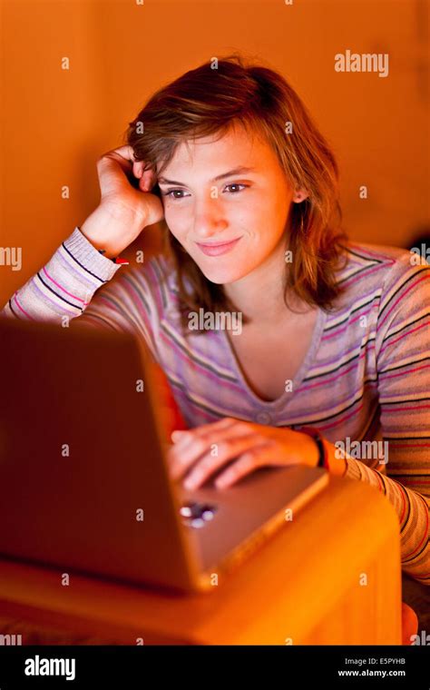 Teenage Girl Using A Laptop Stock Photo Alamy