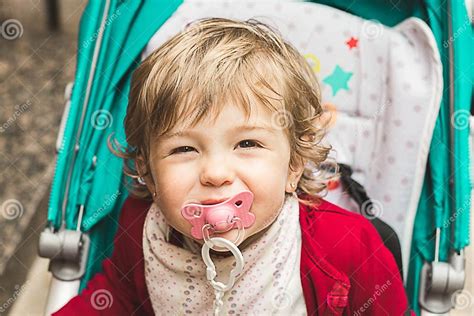 Little Girl With A Pacifier In Her Mouth Stock Image Image Of Little