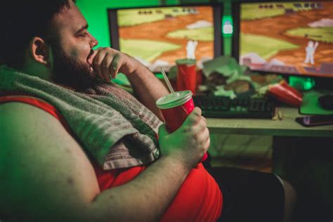 Fat Guy Playing Video Games Stock Photos Pictures And Royalty Free