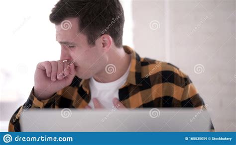 The Close Up Of Ill Young Man Coughing At Work Stock Image Image Of
