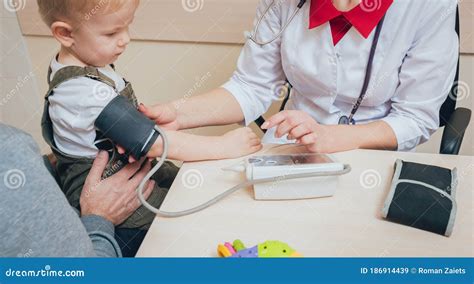 Doctor Measuring Blood Pressure Of A Child Stock Image Image Of