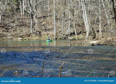 Man Kayaking On The Little Miami River In The Spring Near Yellow