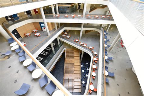 Aerial View Of Atrium And Staircase In Modern University Building Stock