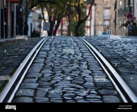 Tram Tracks In Stone Paved Street Lisbon Stock Photo Alamy