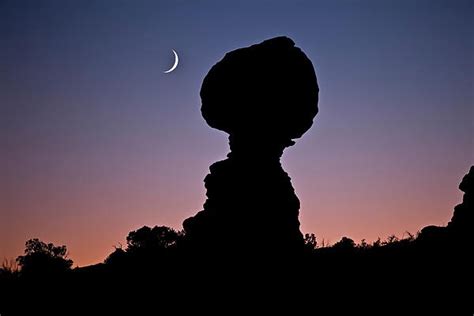 Hanging In The Balance Moonrise Next To Balanced Rock In Arches