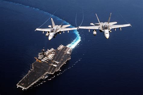 Two F A C Hornet Aircraft Of Strike Fighter Squadron Fly Above The Forrestal Class