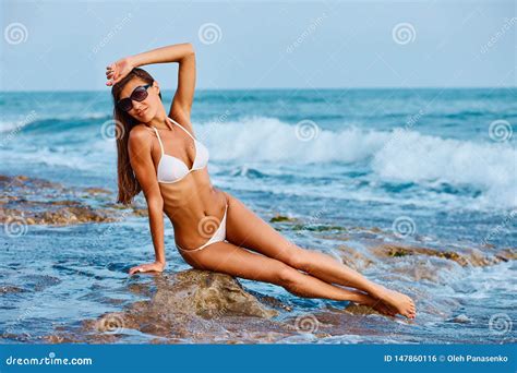 Portrait Of Beautiful Tanned Woman Posing In Colorful Swimwear Bikini