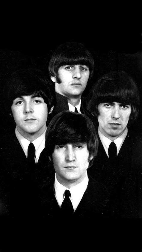 The Beatles In Black And White Posing For A Photo With Their Heads