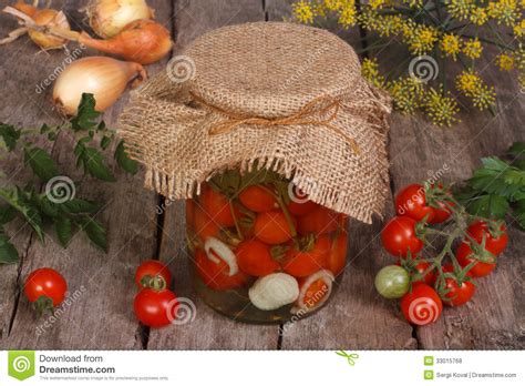 Canned Cherry Tomatoes In A Glass Jar On Wooden Stock Photo Image Of