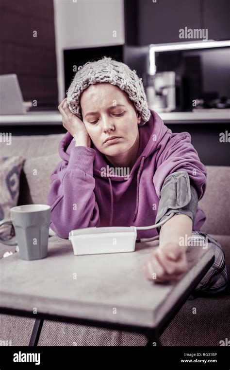 Negative Delighted Woman Checking Her Blood Pressure Stock Photo Alamy