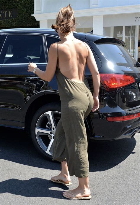minka kelly shows some skin in a backless olive green jumpsuit as she hits the shops artofit