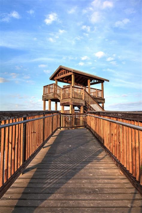 Bird Observation Tower At The End Of A Boardwalk At Sunrise On