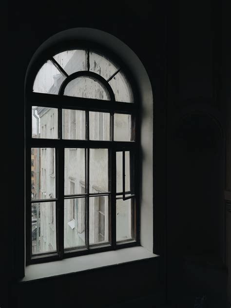 Arched Glass Window With Dark Background · Free Stock Photo