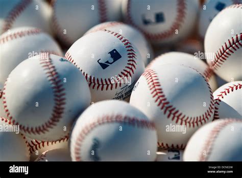 Stack Of Major League Baseball Baseballs On The Field During Batting
