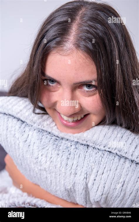 Beautiful Young Woman Is Relaxing Bend Over Her Pillow Stock Photo Alamy
