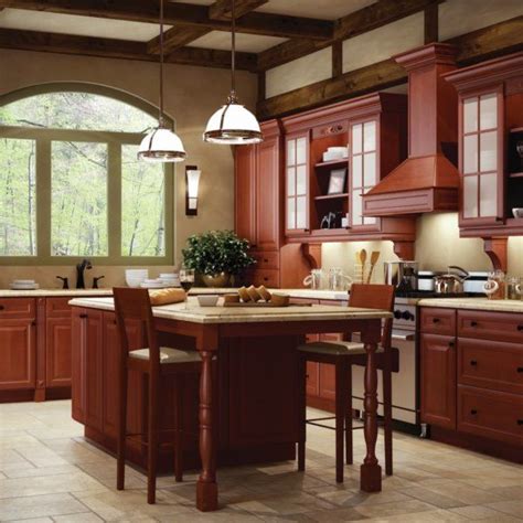 A Kitchen With Wooden Cabinets And An Island In Front Of The Stove Top
