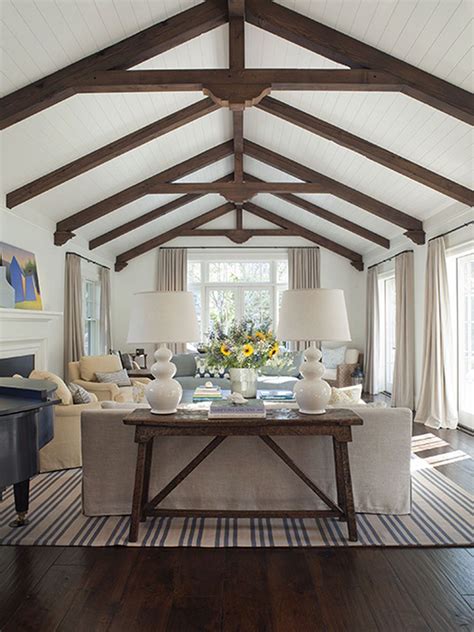 This allowed for a reconfiguration of the interior spaces, so living areas and the master bedroom would be. White Living Rooms Vaulted Ceilings Beams - DECORATHING