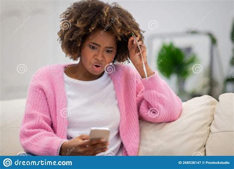 Shocked Black Woman Looking At Phone Screen Copy Space Stock Image
