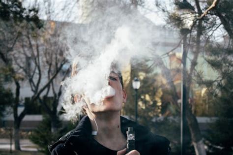 Selective Focus Photography Of Man Doing Vape Trick · Free Stock Photo