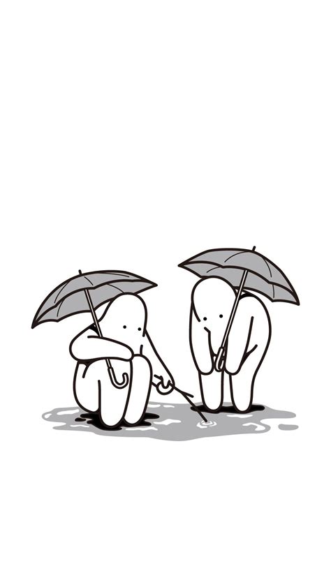 two elephants standing next to each other holding umbrellas