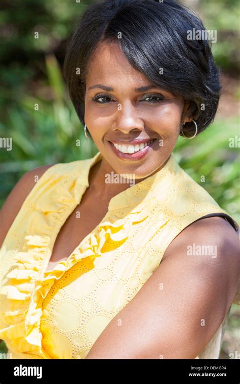 A Beautiful Happy Middle Aged African American Woman Relaxing And