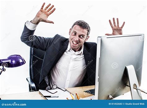 Upset Businessman Having A Corporate Tantrum At His Computer Desk Stock