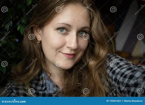 Portrait Of Beautiful Young European Girl Looking At The Camera A Nice Woman Takes A Selfie