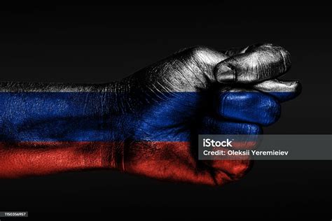 A Hand With A Painted Russia Flag Shows A Fig A Sign Of Aggression