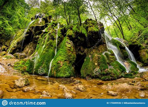 Beautiful Beusnita Waterfall In The Forest With Green Moss
