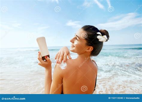 Woman Applying Sunscreen Creme On Tanned Shoulder Skincare Body Sun Protection Suncream Stock
