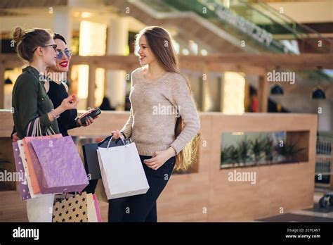 Three Womans Shopping In Mall With Papperbags Stock Photo Alamy
