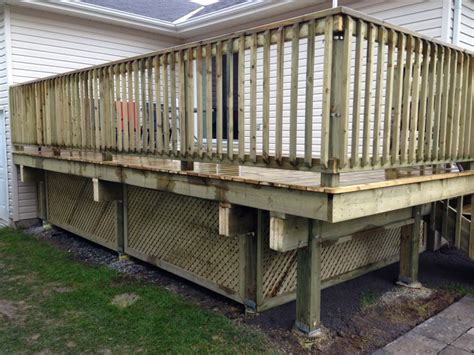 We have a townhouse in a city with a partial rooftop deck (10'x10', although the actual size of the roof is about 2.5 times that…). Wood Deck How To Build A Floating Making Do It Yourself Decks Home Elements And Style Proper ...