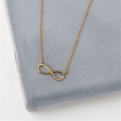 White gold over.925 sterling silver new infinity pendant for women's round cz. gold plated infinity necklace by orelia fine | notonthehighstreet.com