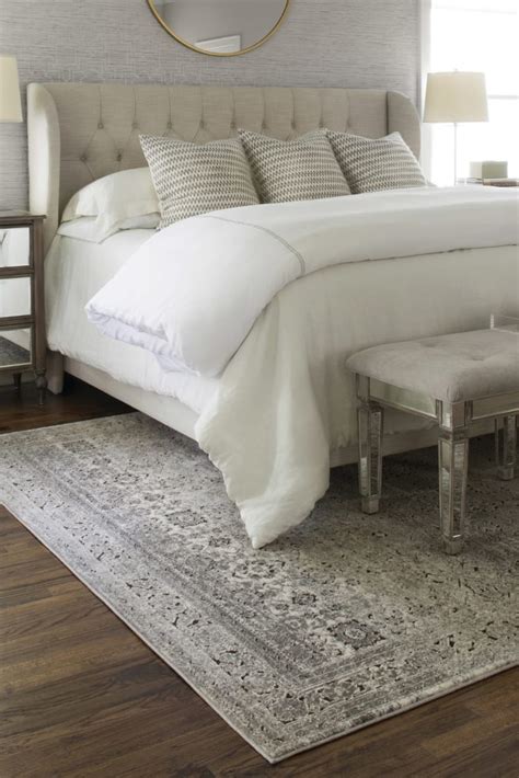 Placing an area rug beneath a bed in an offset manner provides maximum visual appeal. How to Choose the Perfect Bedroom Area Rug | Overstock.com