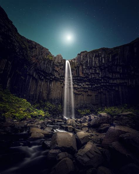 Moonlight Over Black Waterfall Iceland Todays Image Earthsky
