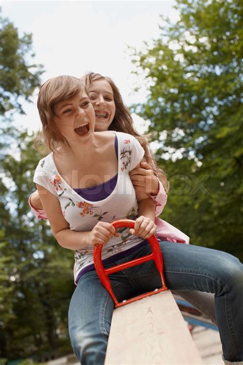 2 Girls Having Fun Together In A Park Stock Image Colourbox