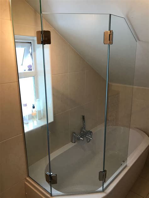 Frameless Pentagonal Bifold Bath Shower Screen To Curved Bath With