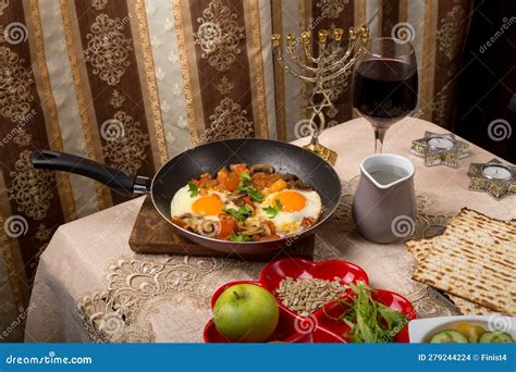 A Set Table For The Passover Seder With Traditional Matzah Wine Maror And Shakshuka In A