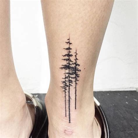 Pine Tree Tattoo An Ankle Three Black Pine Trees Inked On The Back Of