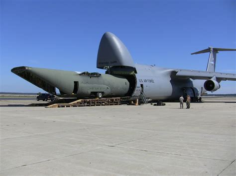 Boeing C5 Galaxy While Eating Fuselage Of C130 Hercules Aircraft